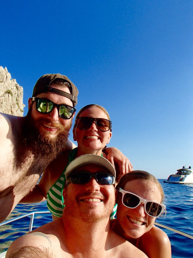 The whole crew of our boat on the turquoise waters surrounding Capri